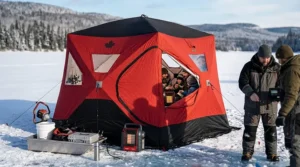 Interior view of a spacious 6 man insulated ice tent showing enough room for six chairs and fishing gear.