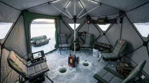 Top-down view illustration of a spacious hub style ice fishing shelter interior with room for multiple anglers.