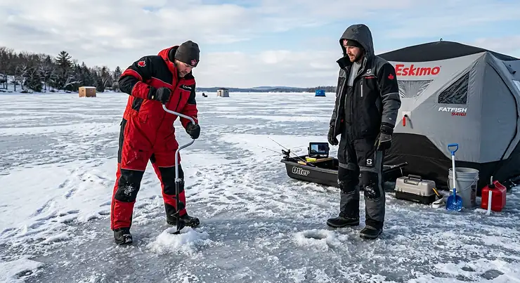 Alt text for image 1: A side-by-side comparison of a professional one-piece vs two-piece ice suit on an frozen Canadian lake, demonstrating winter gear options for extreme cold. one piece vs two piece ice suit