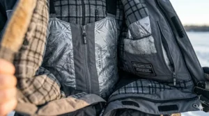 Close-up of the thermal fleece lining and insulation layers in high-performance ice fishing bibs.