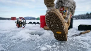 Detailed view of the high-traction rubber soles on mukluks to prevent slipping on frozen lakes while ice fishing.