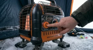Easy-to-use ignition button on safe heater for ice fishing tent.