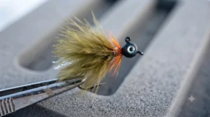 Hand-tied marabou crappie ice fishing jig featuring life-like motion in cold water.