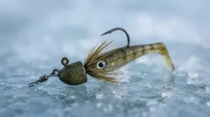 Close-up of a premium tungsten walleye jig designed for precision ice fishing.