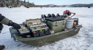 Heavy-duty jet sled for ice fishing packed with an ice auger and tackle box.