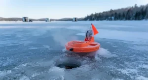 A freeze-resistant plastic tip-up operating smoothly in sub-zero temperatures on a frozen Canadian bay.
