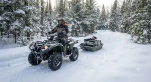 A jet sled for ice fishing hitched and towed behind an ATV on a Canadian winter trail.