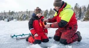 Young ice angler learning about ice safety and how to properly wear ice fishing picks before heading onto the lake.