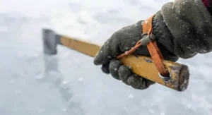 Close-up of a safety wrist strap on an ice chisel for safety to prevent loss while breaking ice.
